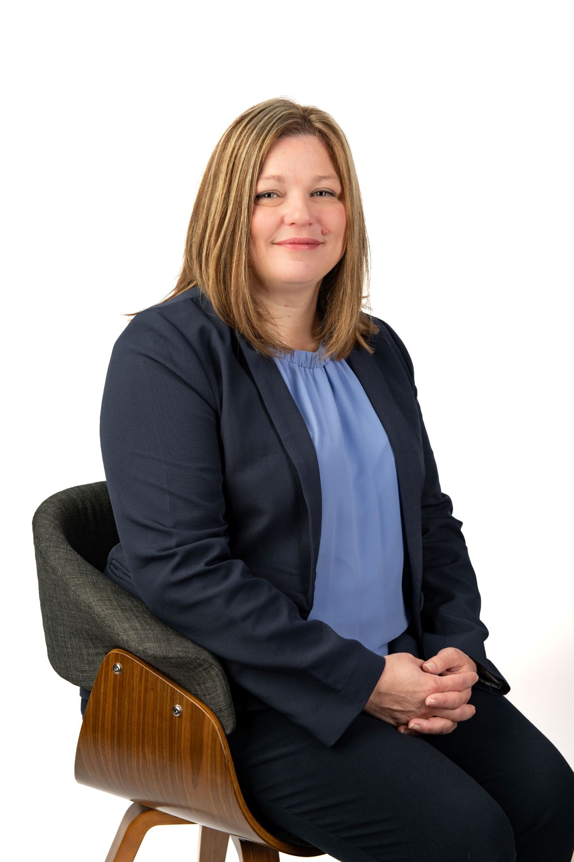 Jennifer Harlow seated in her professional portrait